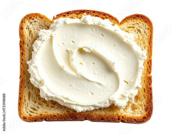 Fototapeta Close-up of toasted bread slice with generous swirls of smooth, white spread