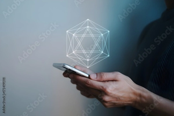 Fototapeta Hand holding smartphone with geometric shape futuristic technology concept augmented reality interface