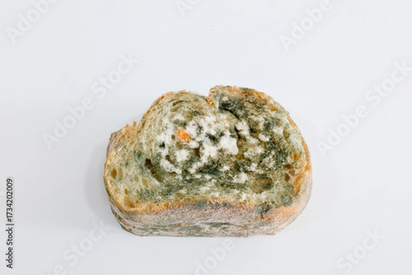 Fototapeta Close-up of Moldy bread on cutting board
