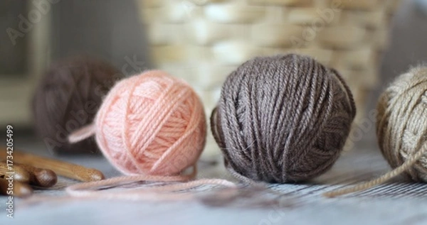 Obraz Clews balls of yarn wool and crochet hooks and a basket photo 