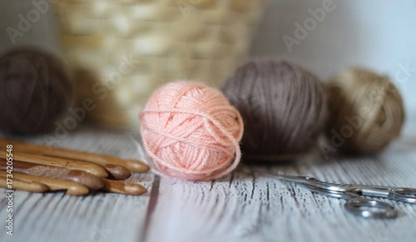 Obraz Clews balls of yarn wool and crochet hooks and a basket photo 