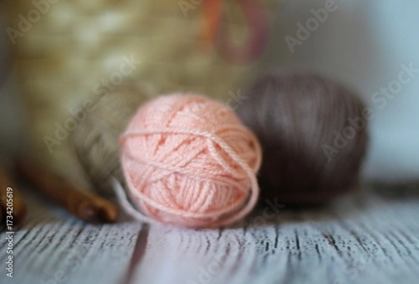 Obraz Clews balls of yarn wool and crochet hooks and a basket photo 