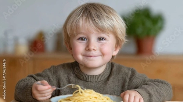 Fototapeta Happy Little Child Enjoys Delicious Plate of Spaghetti with Smiling Face and Joyful Expression at Home Kitchen Table