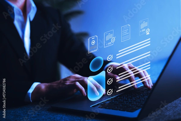 Fototapeta Businessman verifying digital personal profile data on laptop screen, illustrating identity verification, digital onboarding, and personal information security technology.