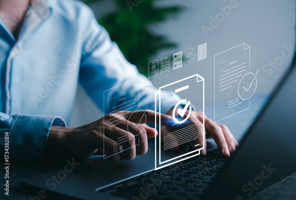 Fototapeta Digital document approval process on laptop screen with checkmark icon, representing paperless workflow, e-signature, and secure document verification.