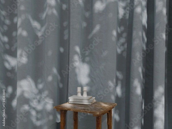 Fototapeta Rustic wooden table with books and candles in front of  Slate Blue-Gray curtain, natural sunlight shadow interior mockup background 