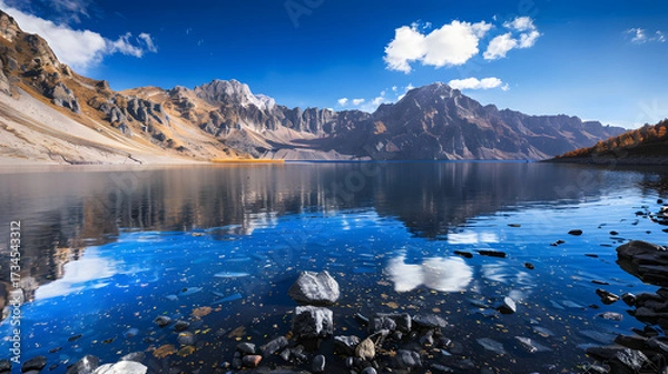Obraz The Changbaishan Tianchi: A Majestic Volcanic Crater Lake on the China-North Korea Border in Jilin, China—Boasting Crystal-Clear Blue Water, Surrounded by Snow-Capped Peaks & Coniferous Forests, Ideal