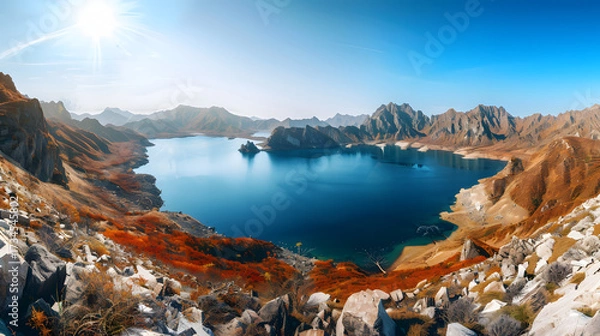Obraz The Changbaishan Tianchi: A Majestic Volcanic Crater Lake on the China-North Korea Border in Jilin, China—Boasting Crystal-Clear Blue Water, Surrounded by Snow-Capped Peaks & Coniferous Forests, Ideal