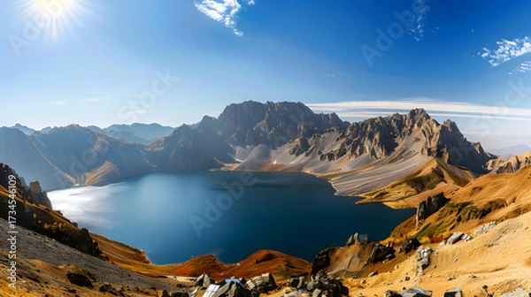 Obraz The Changbaishan Tianchi: A Majestic Volcanic Crater Lake on the China-North Korea Border in Jilin, China—Boasting Crystal-Clear Blue Water, Surrounded by Snow-Capped Peaks & Coniferous Forests, Ideal