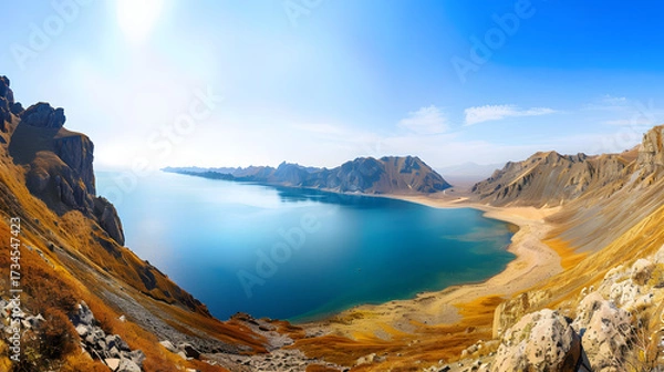 Obraz The Changbaishan Tianchi: A Majestic Volcanic Crater Lake on the China-North Korea Border in Jilin, China—Boasting Crystal-Clear Blue Water, Surrounded by Snow-Capped Peaks & Coniferous Forests, Ideal