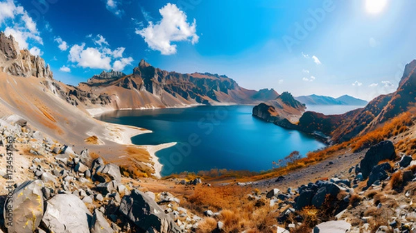 Obraz The Changbaishan Tianchi: A Majestic Volcanic Crater Lake on the China-North Korea Border in Jilin, China—Boasting Crystal-Clear Blue Water, Surrounded by Snow-Capped Peaks & Coniferous Forests, Ideal