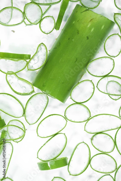 Fototapeta Top View of Sliced Aloe Vera Pieces on a White Background