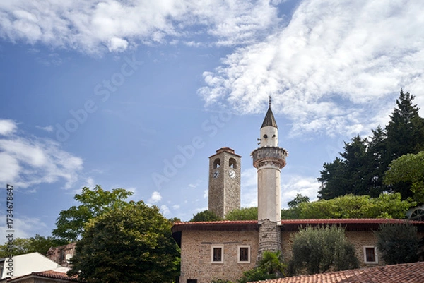 Fototapeta Historic stone clock tower and minaret in Ulcinj