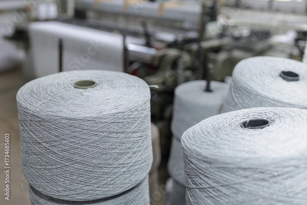Fototapeta Yarn spools in textile factory spinning and weaving production