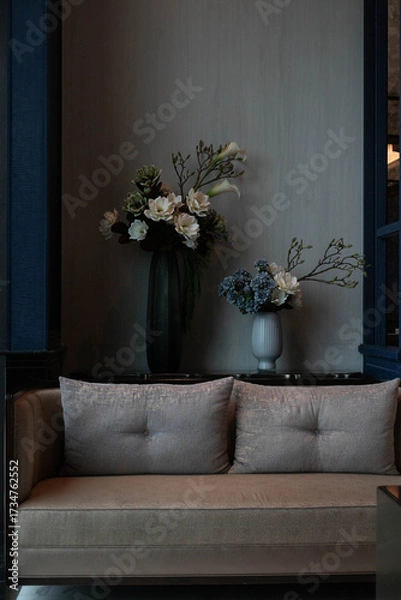 Fototapeta Interior of waiting area, A comfortable-looking sofa with two tufted cushions