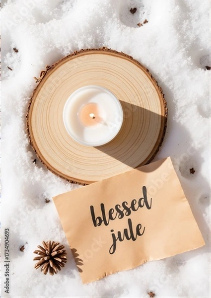 Fototapeta Candle on wooden slice with handwritten note in snow background  