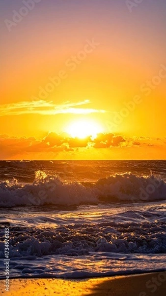 Obraz Radiant Orange Sunset over Wavy Ocean with Reflection in Dramatic Cinematic Lighting on Sandy Beach