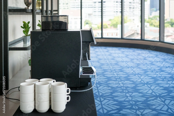 Fototapeta Hotel convention center hallway with coffee maker and cups. 