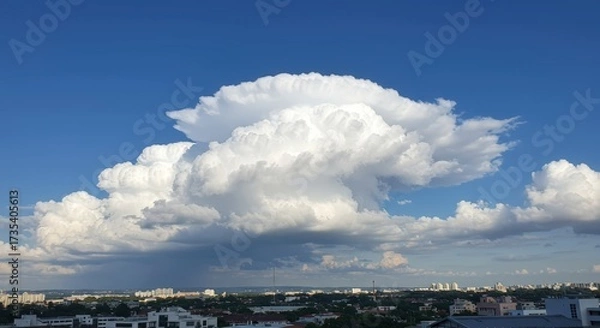 Fototapeta Dramatic cloud formation against a clear blue sky creating dynamic weather landscape for atmospheric illustration