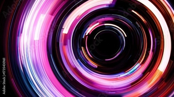 Fototapeta Colorful light trails create a dynamic swirl effect in a dark setting with vibrant hues and motion