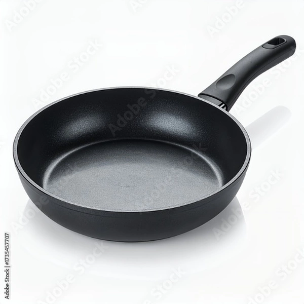 Fototapeta Isolated non-stick frying pan against a bright white backdrop in a studio setting