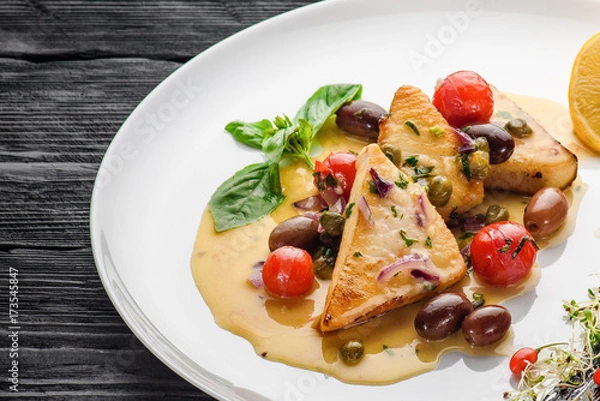 Obraz Swordfish fillet prepared by the Sicilian recipe. Decorated with goji.