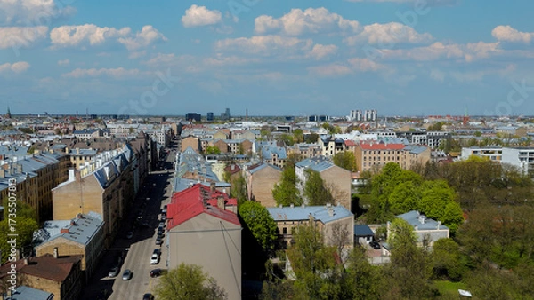 Fototapeta Aerial Drone View Of Riga Panorama In Latvia On A Sunny Spring Day Showcasing The Rooftops Of Houses The Vibrant City Center Historic Buildings And Barona Street Playground of the Downtown Sports Area