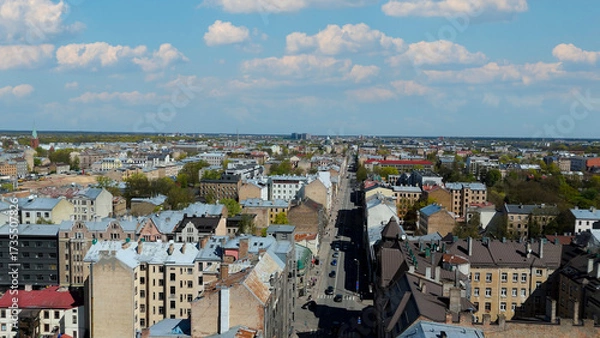 Fototapeta Aerial Drone View Of Riga Panorama In Latvia On A Sunny Spring Day Showcasing The Rooftops Of Houses The Vibrant City Center Historic Buildings And Barona Street Playground of the Downtown Sports Area