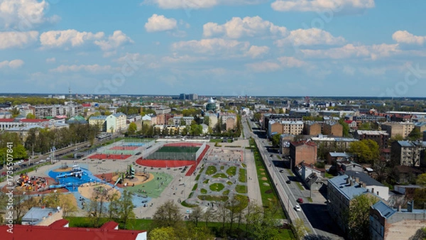 Fototapeta Aerial Drone View Of Riga Panorama In Latvia On A Sunny Spring Day Showcasing The Rooftops Of Houses The Vibrant City Center Historic Buildings And Barona Street Playground of the Downtown Sports Area