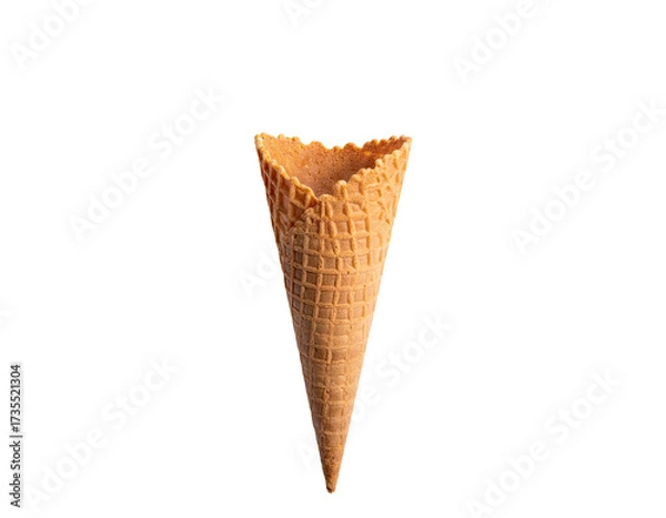 Fototapeta Close-up of an empty waffle cone against a solid black background
