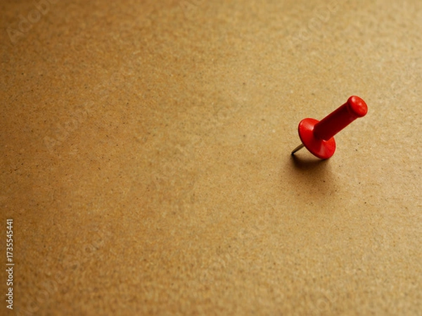 Fototapeta red push pin on cork board, isolated background