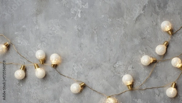 Obraz Festive String Lights on Gray Concrete Background.