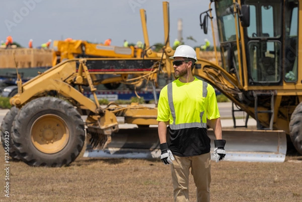 Fototapeta Supervisor at object. Worker at construction site. Builder construction man. Worker supervisor heavy machinery. Safety inspection. Industry construction worker. Builder civil engineer at building