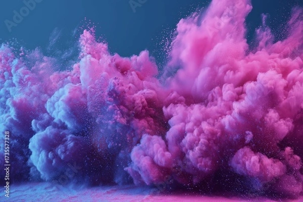 Fototapeta Vibrant pink neon powder bursts with illuminated frame against a blue backdrop surrounded by a colorful dust cloud