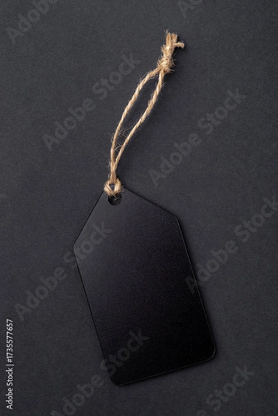 Fototapeta Empty black tag on black background.