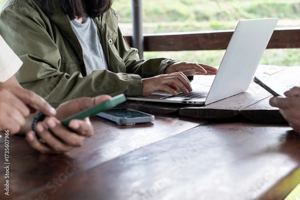Fototapeta Female hands typing on laptop keyboard, close-up view, concept of work, study, online communication, and modern digital lifestyle.