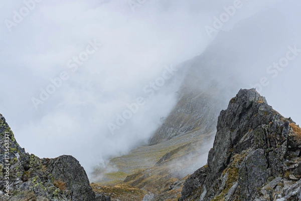 Obraz mountain landscape with fog on sharp ridge on autumn day