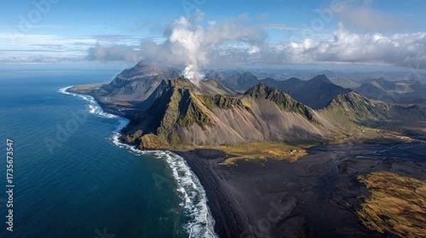 Obraz Icelandic coastal mountains, black sand beach, ocean meeting green cliffs, cloudy sky