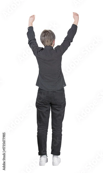 Fototapeta Rear view full length portrait of successful young woman raising hands up celebrating an achievement. Contented female isolated on transparent background