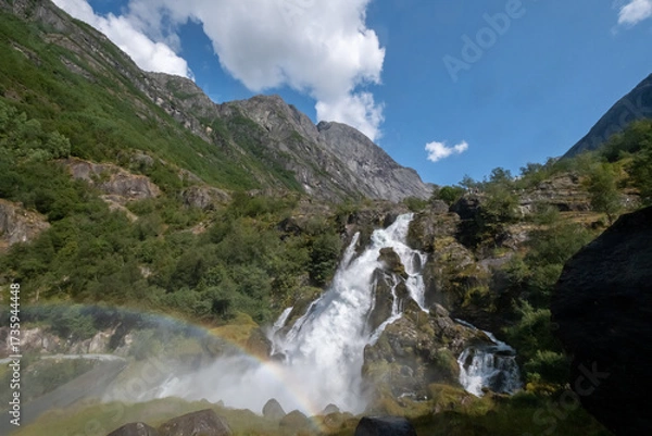 Fototapeta Rainbow on waterfall Kleivafossen fed by Briksdal Glacier. Norway