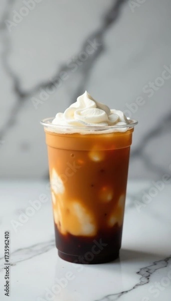 Fototapeta Iced espresso in plastic cup, black marble background Copy space , design, texture