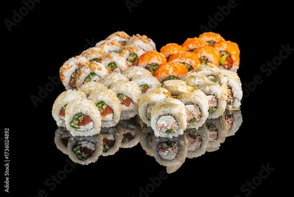 Fototapeta Delicious assorted sushi rolls with fresh ingredients reflected on a black glossy surface, ideal for restaurant advertising and menu design