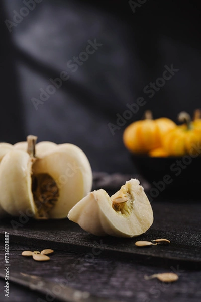 Fototapeta Slice of white pumpkin on dark background, abstract autumn, concept, copy space