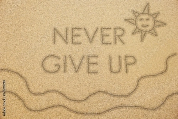 Fototapeta never give up word with smiling sun and wave on fine sand