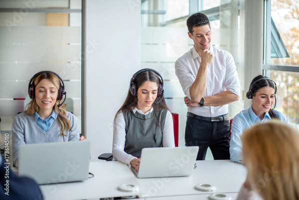 Obraz Supervisor observing agents at workstations