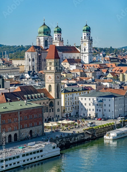 Fototapeta Passau, Bavaria, Germany: high view on the old town along the Danube river with the Town Hall and St Stephan cathedral; Danube cruise ships are moored