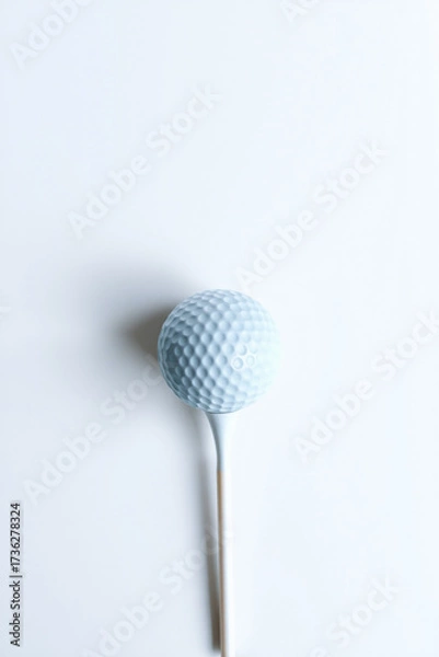 Obraz A Golf Ball On A Tee On A White Background