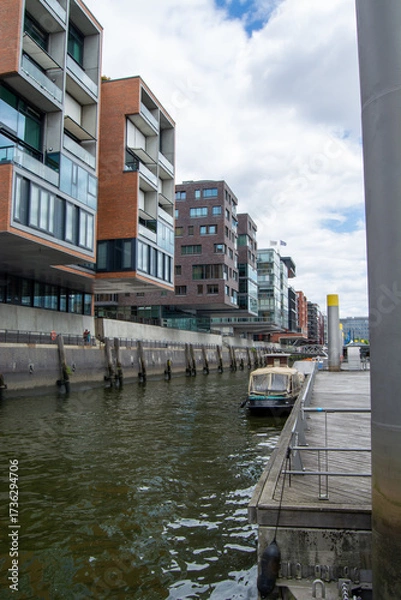 Fototapeta Modern waterfront buildings along a canal