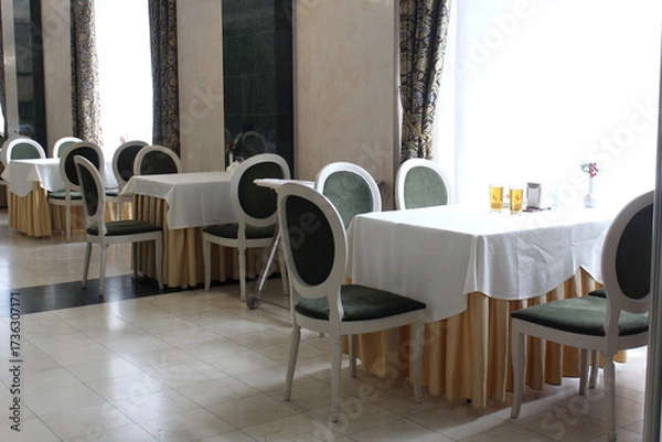 Obraz Indoor cafe with tables and chairs.