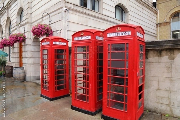 Obraz London red telephone in rainy weather. English symbol - red phone booths street view in the City of Westminster.